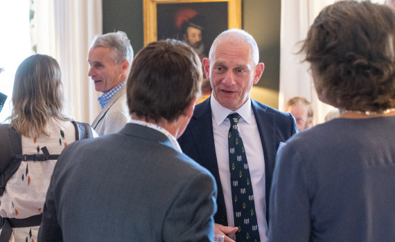 Provost speaking to alumni in his dining room