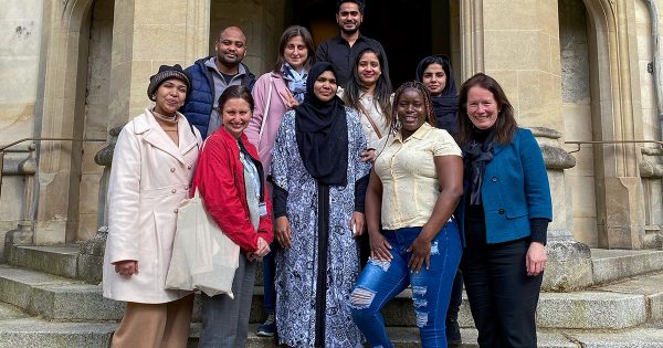Visitors from MultakaOxford with Treasurer of Oriel College Maggie Jones outside in First Quad