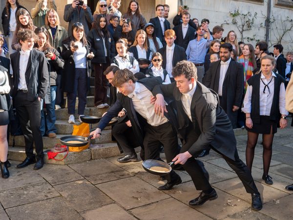 Image of Oxford students don gowns for pancake relay